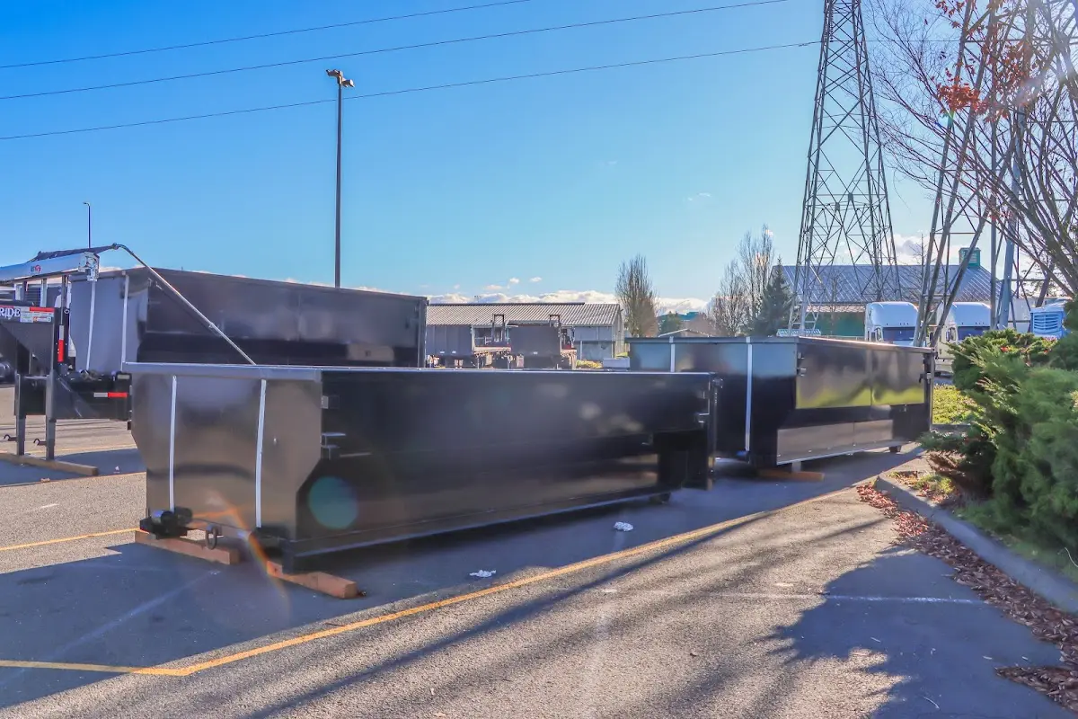 Roll-off dumpster ready for waste disposal at job site for Concrete Dumpster Rental in Berlin